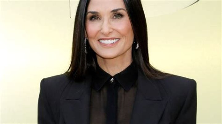 '90s Icon Demi Moore Shares Swimsuit Photo Under a Waterfall